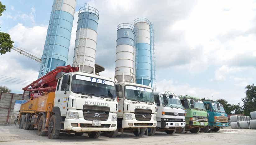 TCR concrete batching plant and delivery trucks in Laos